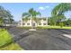 Beautiful home with a circular driveway, mature trees, and a spacious yard at 14485 Switch Back Rd, Brooksville, FL 34609