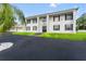 Two-story white house with columns and a long driveway at 14485 Switch Back Rd, Brooksville, FL 34609