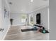 Large home gym with various workout equipment and natural light at 14485 Switch Back Rd, Brooksville, FL 34609