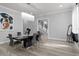 Bright dining room with a modern table and access to the staircase at 14485 Switch Back Rd, Brooksville, FL 34609