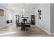 Modern dining room with marble fireplace and large windows at 14485 Switch Back Rd, Brooksville, FL 34609