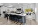 This kitchen features a large island with seating, updated appliances, and modern finishes at 14485 Switch Back Rd, Brooksville, FL 34609