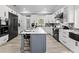 Modern kitchen features an island, sleek appliances, and plenty of cabinet space at 14485 Switch Back Rd, Brooksville, FL 34609