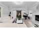 Elegant living room featuring a grand piano, fireplace, and sliding barn doors at 14485 Switch Back Rd, Brooksville, FL 34609