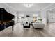 This spacious living room showcases a piano, stylish seating, and natural light at 14485 Switch Back Rd, Brooksville, FL 34609
