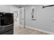 Bright laundry room with a modern LG Signature washer and a built-in mirror at 14485 Switch Back Rd, Brooksville, FL 34609