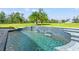 Stunning pool with waterfall and spacious deck at 14485 Switch Back Rd, Brooksville, FL 34609