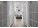 Bright bathroom hallway with light wood flooring and neutral colors at 14485 Switch Back Rd, Brooksville, FL 34609