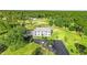 Luxury home on spacious lot with private driveway and lush green surroundings at 14485 Switch Back Rd, Brooksville, FL 34609