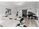Living room boasts a white sectional sofa and a grand piano at 14485 Switch Back Rd, Brooksville, FL 34609