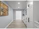 Long hallway with white cabinets and light gray walls at 14485 Switch Back Rd, Brooksville, FL 34609