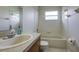 Neat bathroom featuring a tub and single sink vanity at 20743 Nectarine Pl, Land O Lakes, FL 34637