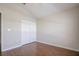 Bedroom with hardwood floors, double door closet and neutral walls at 20743 Nectarine Pl, Land O Lakes, FL 34637