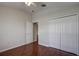 Bedroom with hardwood floors, door to another room and double door closet at 20743 Nectarine Pl, Land O Lakes, FL 34637