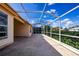 Spacious screened patio overlooking a lush green landscape at 20743 Nectarine Pl, Land O Lakes, FL 34637