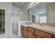 Bathroom with dual sinks, a shower, and a soaking tub at 20743 Nectarine Pl, Land O Lakes, FL 34637