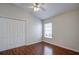 Bedroom with hardwood floors, window with blinds, and neutral walls at 20743 Nectarine Pl, Land O Lakes, FL 34637