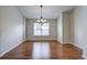 Bright dining room featuring hardwood floors and a chandelier at 20743 Nectarine Pl, Land O Lakes, FL 34637