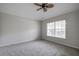 Bright bedroom with ceiling fan, window coverings, and neutral walls at 20743 Nectarine Pl, Land O Lakes, FL 34637