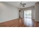 Living room with hardwood floors, sliding doors, and a ceiling fan at 20743 Nectarine Pl, Land O Lakes, FL 34637
