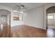 Hardwood floor living room, ceiling fan, view of bathroom and kitchen at 20743 Nectarine Pl, Land O Lakes, FL 34637