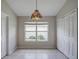Bright dining room with large window and unique light fixture at 20743 Nectarine Pl, Land O Lakes, FL 34637