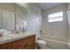 Clean bathroom with a bathtub, sink, and toilet at 20743 Nectarine Pl, Land O Lakes, FL 34637