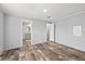This bedroom features stylish wood-look flooring and neutral walls at 4304 Buena Vista Ln, Holiday, FL 34691
