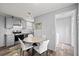 Open concept kitchen and dining area with stainless steel appliances at 4304 Buena Vista Ln, Holiday, FL 34691