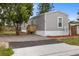 Inviting exterior with gray siding, complemented by a fresh deck and well-kept gravel landscape at 4304 Buena Vista Ln, Holiday, FL 34691