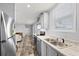 Bright kitchen featuring stainless steel appliances and granite countertops at 4304 Buena Vista Ln, Holiday, FL 34691