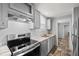 Modern kitchen featuring stainless steel appliances and granite countertops at 4304 Buena Vista Ln, Holiday, FL 34691