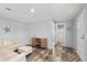 Open-concept living room offers seamless access to the bathroom and ample space at 4304 Buena Vista Ln, Holiday, FL 34691