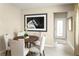 Bright dining area with round table and four chairs, adjacent to entryway at 4636 Spire Run, Lakewood Ranch, FL 34211