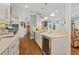 Bright kitchen with white cabinetry, modern appliances, and lots of counter space at 5632 Egrets Pl, New Port Richey, FL 34652