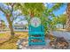 Private beach club access with a welcoming teal chair at 5632 Egrets Pl, New Port Richey, FL 34652