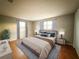 Main bedroom with wood-look flooring and window coverings at 6417 Sutherland Ave, New Port Richey, FL 34653