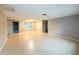 Spacious living room with tile flooring and neutral walls at 6417 Sutherland Ave, New Port Richey, FL 34653