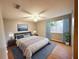 Main bedroom with wood-look flooring and ceiling fan at 6417 Sutherland Ave, New Port Richey, FL 34653