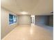 Open living area with tile floors and ample natural light at 6417 Sutherland Ave, New Port Richey, FL 34653