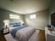 Main bedroom with wood-look flooring and stylish decor at 6417 Sutherland Ave, New Port Richey, FL 34653