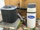 Exterior view of AC unit and water softener at 7634 Topay Ln, Port Richey, FL 34668