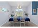 Dining room with a table, chairs, and a large window at 8231 Coral Creek Loop, Hudson, FL 34667