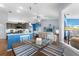 Bright dining area with wood table and blue and white striped placemats at 8231 Coral Creek Loop, Hudson, FL 34667