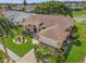 Stunning aerial view of a house with a large yard and neighborhood at 8231 Coral Creek Loop, Hudson, FL 34667