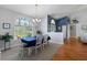 Charming dining area with table and chairs, open to the living room at 8231 Coral Creek Loop, Hudson, FL 34667