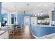 Spacious kitchen featuring modern cabinetry, breakfast bar, and an open layout to the dining area at 8231 Coral Creek Loop, Hudson, FL 34667