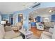Open living space with easy flow between the kitchen, dining, and sunroom areas at 8231 Coral Creek Loop, Hudson, FL 34667