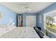 Bedroom with queen bed and coastal decor at 8231 Coral Creek Loop, Hudson, FL 34667