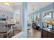 Bright sunroom connected to the dining room creates a seamless living experience at 8231 Coral Creek Loop, Hudson, FL 34667